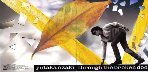 A collage featuring a person climbing over a large yellow leaf, with fragments of a broken door and the text 'yutaka ozaki through the broken doo' in bold letters.